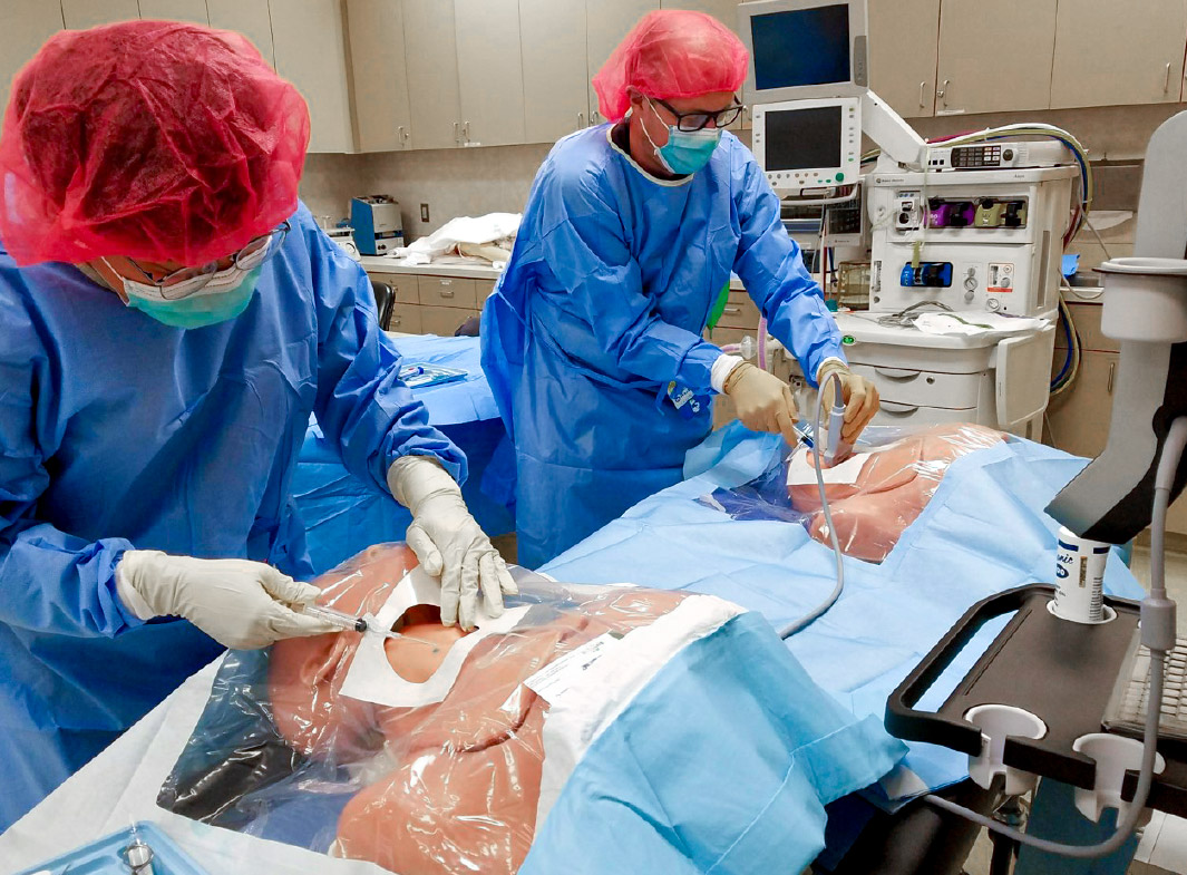 Doctors Practicing Surgery In School